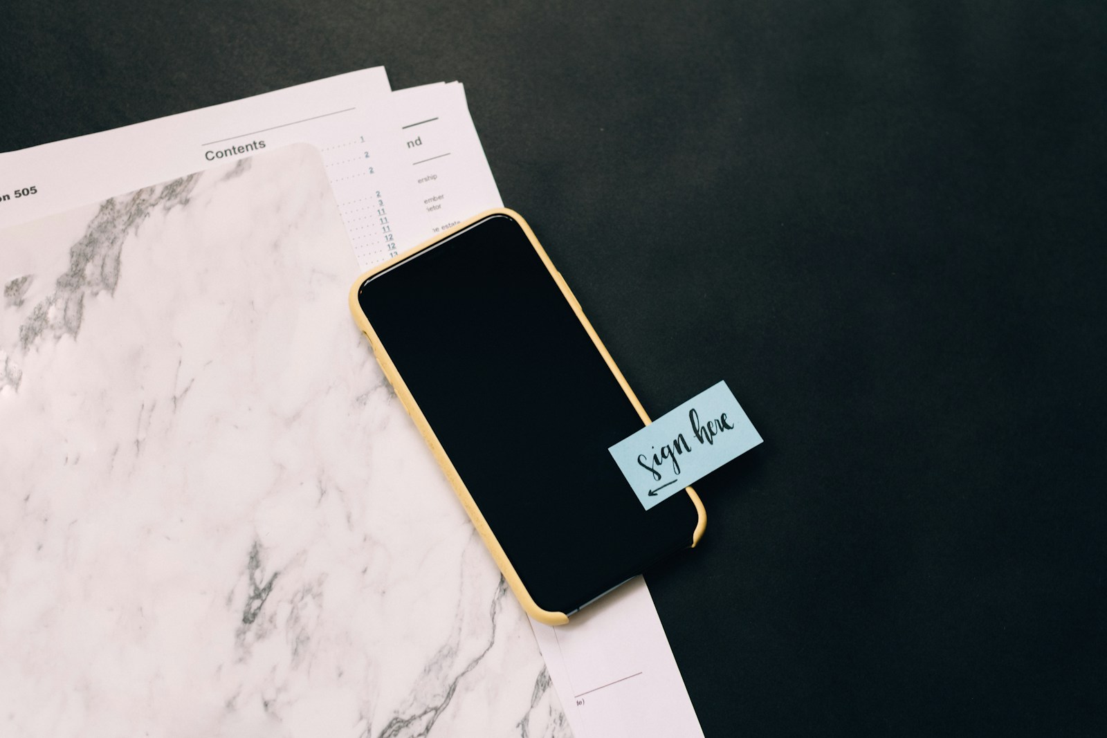 Photo by Kelly Sikkema black smartphone on white pad